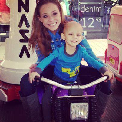 Landon Riddle Landon with a family friend while on chemotherapy and cannabis treatments.